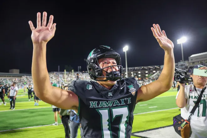 Dec 24, 2025; Honolulu, HI, USA; Hawaii Rainbow Warriors place kicker Kansei Matsuzawa (17) reacts with fans after the Rainbow Warriors defeated the California Golden Bears 53-31 to win the Hawaii Bowl at the Clarence T.C. Ching Athletics Complex. Mandatory Credit: Marco Garcia-Imagn Images
