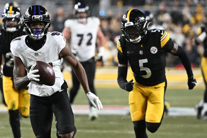 Jan 4, 2026; Pittsburgh, Pennsylvania, USA; Baltimore Ravens wide receiver Devontez Walker (81) scores a touchdown against Pittsburgh Steelers cornerback Jalen Ramsey (5) during the first half at Acrisure Stadium. Mandatory Credit: Barry Reeger-Imagn Images