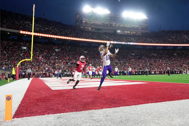 Nov 8, 2025; Madison, Wisconsin, USA; Washington Huskies wide receiver Denzel Boston (12) catches a pass to score a touchdown during the second quarter against the Wisconsin Badgers at Camp Randall Stadium. Mandatory Credit: Jeff Hanisch-Imagn Images
