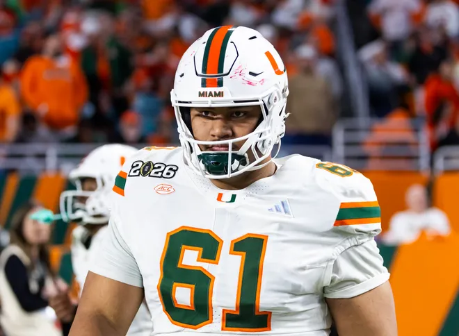 Jan 19, 2026; Miami Gardens, FL, USA; Miami Hurricanes offensive lineman Francis Mauigoa (61) against the Indiana Hoosiers during the College Football Playoff National Championship game at Hard Rock Stadium. Mandatory Credit: Mark J. Rebilas-Imagn Images