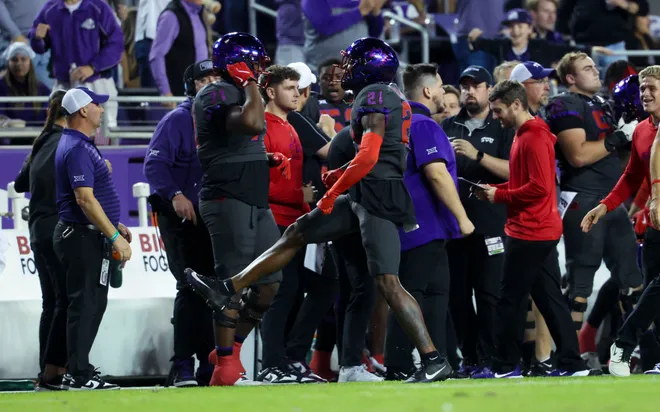 Nov 9, 2024; Fort Worth, Texas, USA; TCU Horned Frogs safety Bud Clark (21) reacts after making an interception during the first half against the Oklahoma State Cowboys at Amon G. Carter Stadium. Mandatory Credit: Kevin Jairaj-Imagn Images
