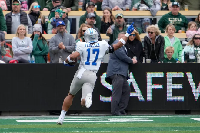 Sep 10, 2022; Fort Collins, Colorado, USA; Middle Tennessee Blue Raiders safety Tra Fluellen (17) scores a pick six touchdown on the first play from scrimmage at Sonny Lubick Field at Canvas Stadium. Mandatory Credit: Michael Madrid-USA TODAY Sports