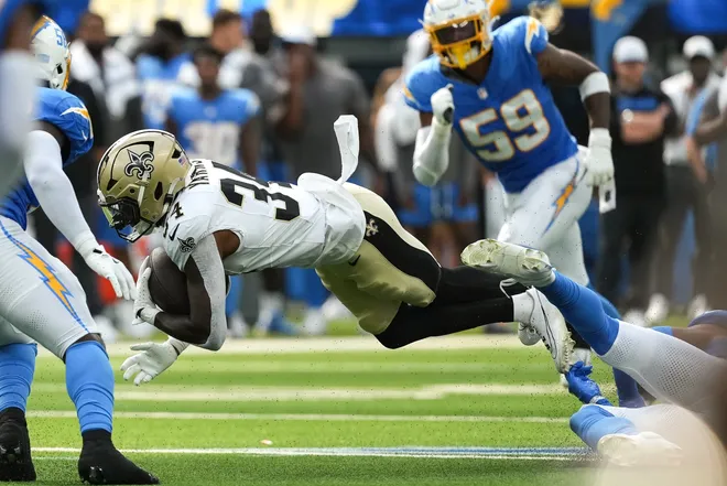 Aug 10, 2025; Inglewood, California, USA; New Orleans Saints running back Marcus Yarns (34) is tackled in the fourth quarter against the Los Angeles Chargers at SoFi Stadium. Mandatory Credit: Jon Endow-Imagn Images