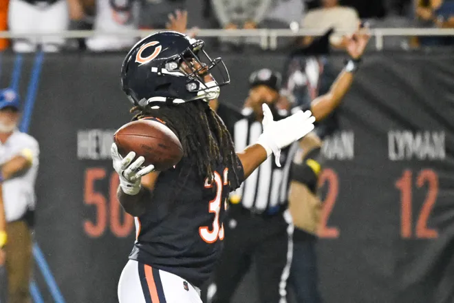 Aug 17, 2025; Chicago, Illinois, USA; Chicago Bears running back Ian Wheeler (33) raises his arms after scoring a touchdown during the second half against the Buffalo Bills at Soldier Field. Mandatory Credit: Matt Marton-Imagn Images