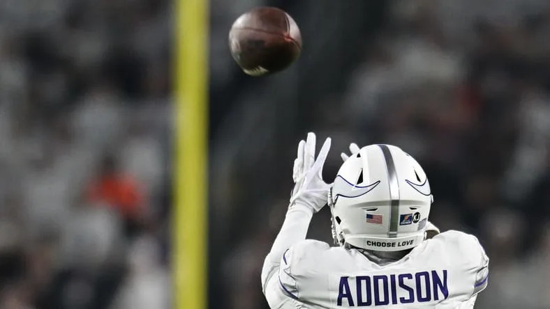Jordan Addison catches a pass while Bears cornerback Terell Smith defends at U.S. Bank Stadium. Vikings rumors 2026