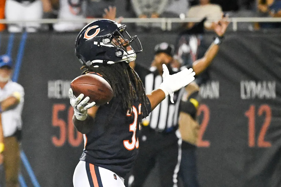 Aug 17, 2025; Chicago, Illinois, USA; Chicago Bears running back Ian Wheeler (33) raises his arms after scoring a touchdown during the second half against the Buffalo Bills at Soldier Field. Mandatory Credit: Matt Marton-Imagn Images