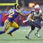 New England Patriots running back Rex Burkhead (34) runs against Los Angeles Rams cornerback Marcus Peters (22) in the fourth quarter in Super Bowl LIII at Mercedes-Benz Stadium.