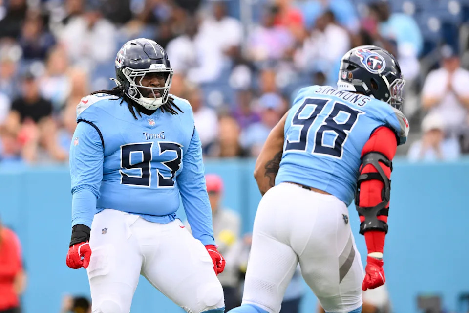 Dec 28, 2025; Nashville, Tennessee, USA; Tennessee Titans defensive tackle Jeffery Simmons (98) and defensive tackle T'Vondre Sweat (93) celebrate a New Orleans Saints fumble during the first quarter of the game at Nissan Stadium. Mandatory Credit: Steve Roberts-Imagn Images