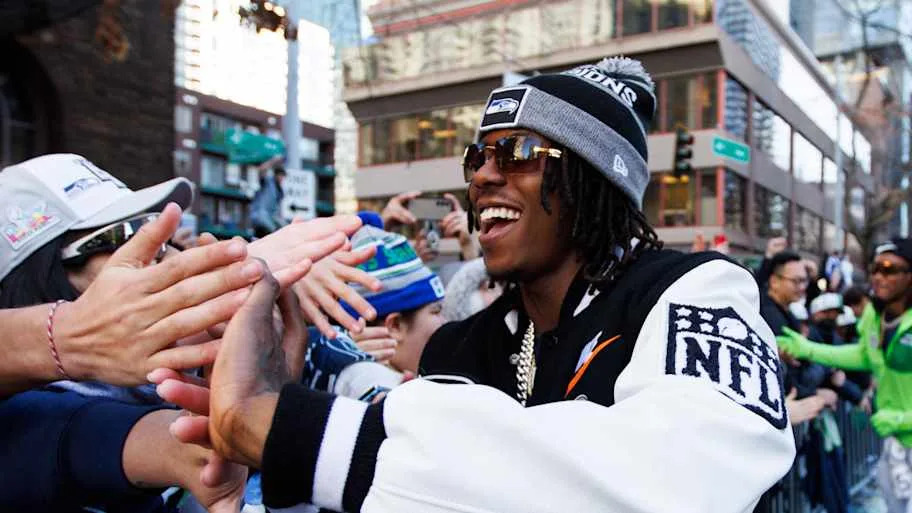 Rashid Shaheed celebrating with Sehawks fans during the Super Bowl parade.