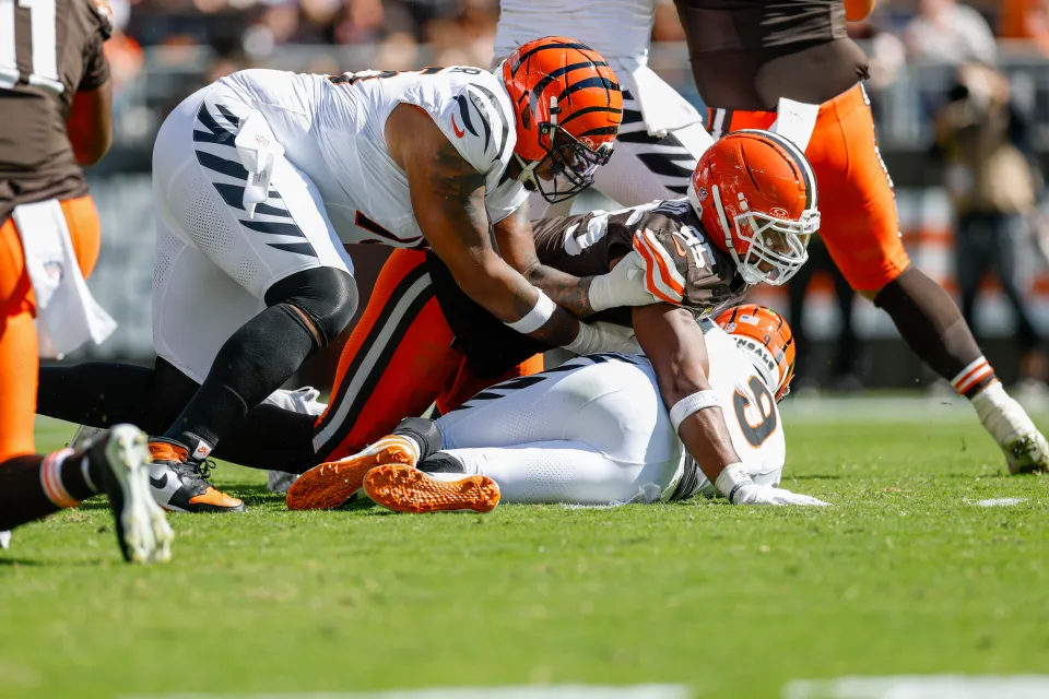 Myles Garrett #95 of the Cleveland Browns sacks Joe Burrow #9 of the Cincinnati Bengals in the fourth quarter during the NFL 2025 game at Huntington Bank Field on September 7, 2025