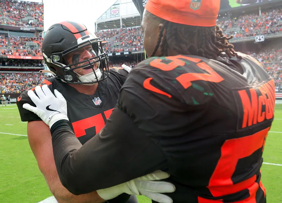 Cleveland Browns guard Wyatt Teller (77) celebrates with defensive end Isaiah McGuire (57) after beating the Green Bay Packers. Jeff Lange-USA TODAY NETWORK via Imagn Images