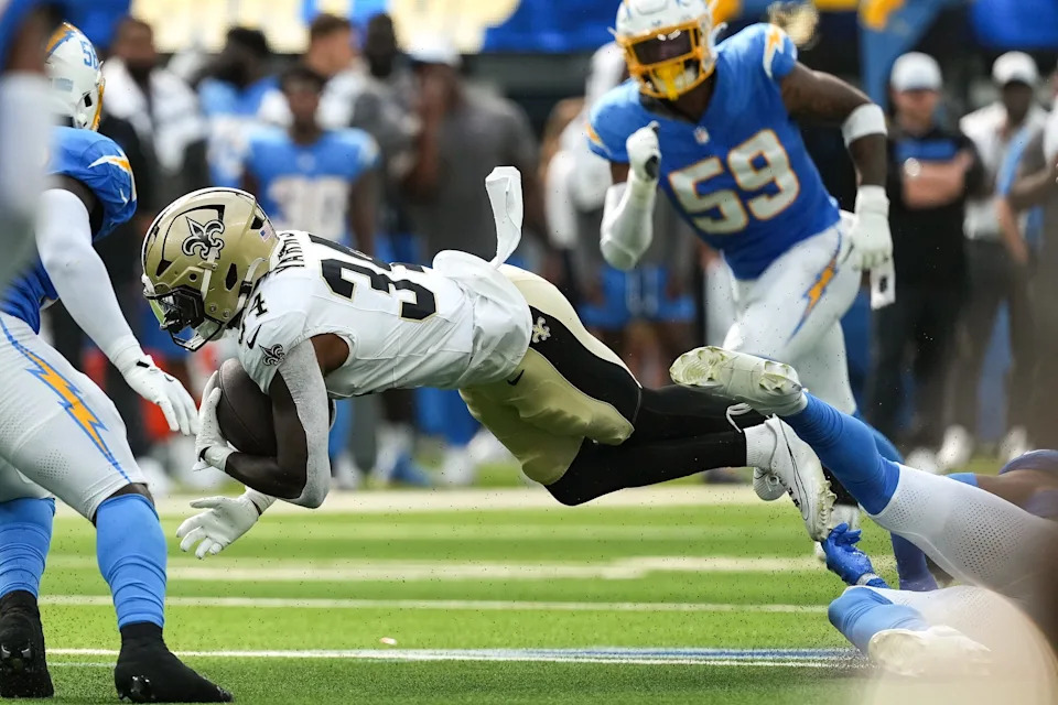 Aug 10, 2025; Inglewood, California, USA; New Orleans Saints running back Marcus Yarns (34) is tackled in the fourth quarter against the Los Angeles Chargers at SoFi Stadium. Mandatory Credit: Jon Endow-Imagn Images