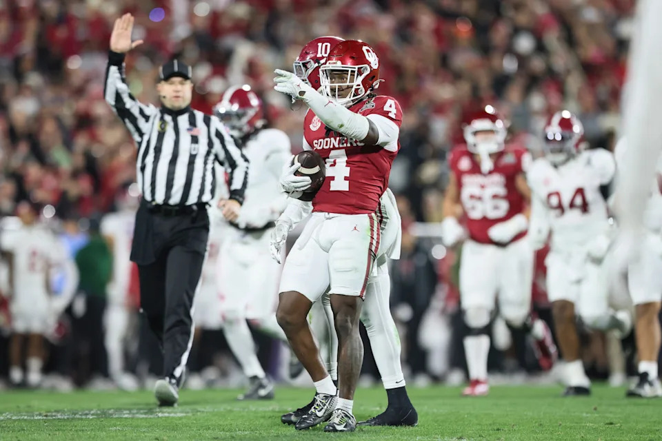 Dec 19, 2025; Norman, OK, USA; Oklahoma Sooners wide receiver Deion Burks (4) gestures in the first half against the Alabama Crimson Tide at Gaylord Family OK Memorial Stadium. Mandatory Credit: Nelson Chenault-Imagn Images