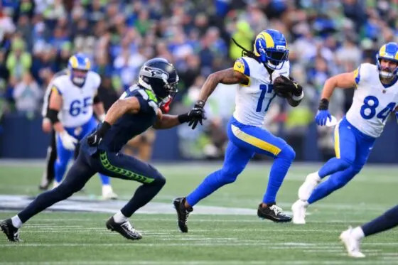 Los Angeles Rams wide receiver Davante Adams (17) runs after a catch against the Seattle Seahawks during the first half in the 2026 NFC Championship Game at Lumen Field.