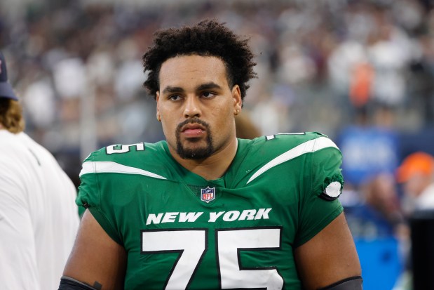 New York Jets guard Alijah Vera-Tucker (75) on the sideline during an NFL game in Arlington, Texas, Sunday, Sept. 17, 2023. (AP Photo/Michael Ainsworth)