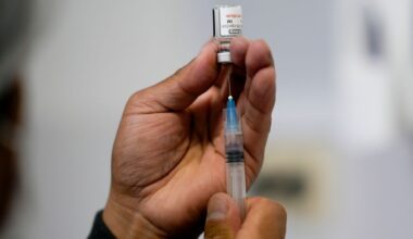 FILE - A healthcare worker prepares a shot of the Pfizer COVID-19 vaccine in La Paz, Bolivia, Jan. 7, 2025. (AP Photo/Juan Karita, File)