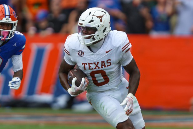 Texas linebacker Anthony Hill Jr. (0) runs the ball after a take-away during an NCAA football game against Florida, Saturday, Oct. 4, 2025, in Gainesville, Fla. Florida defeated Texas 29-21. (AP Photo/Gary McCullough)