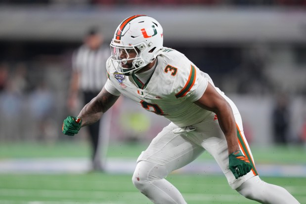 Miami defensive lineman Akheem Mesidor rushes in during the Cotton Bowl College Football Playoff quarterfinal game between Ohio State and Miami Wednesday, Dec. 31, 2025, in Arlington, Texas. (AP Photo/Julio Cortez)