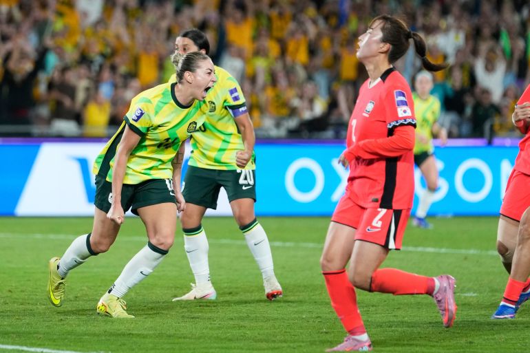 Australia's Alanna Kennedy, left, reacts after scoring her team's third goal during the Women's Asian Cup soccer match between Australia and South Korea in Sydney, Sunday, March 8, 2026. (AP Photo/Rick Rycroft)