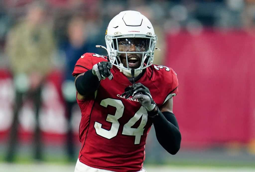 Cowboys 2026 Defensive Identity is Changing Dallas Cowboys defensive changes highlighted by a Cardinals defensive back in red during an NFL game.