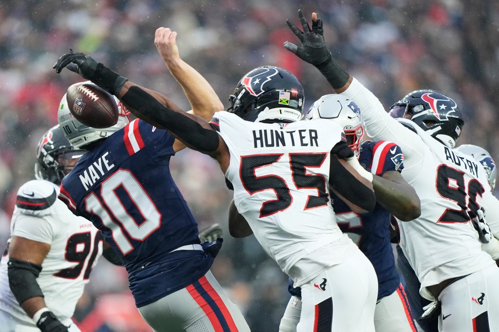Houston Texans defensive end Danielle Hunter (55) sacks and forces New England Patriots quarterback Drake Maye (10) to fumble, which the Patriots recovered, during the first half of an NFL divisional playoff football game, Sunday, Jan. 18, 2026, in Foxborough, Mass.
