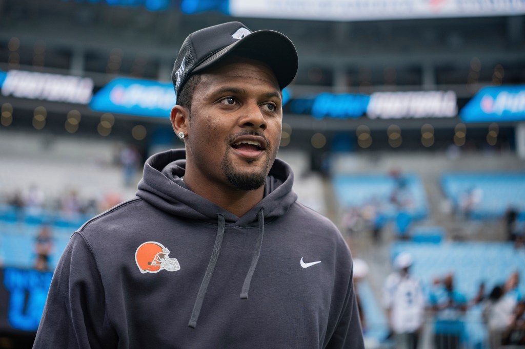 Deshaun Watson in a gray hoodie with a Browns helmet logo.