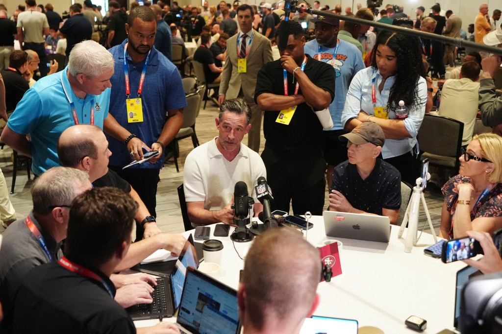 Kyle Shanahan speaks to reporters at a press conference.