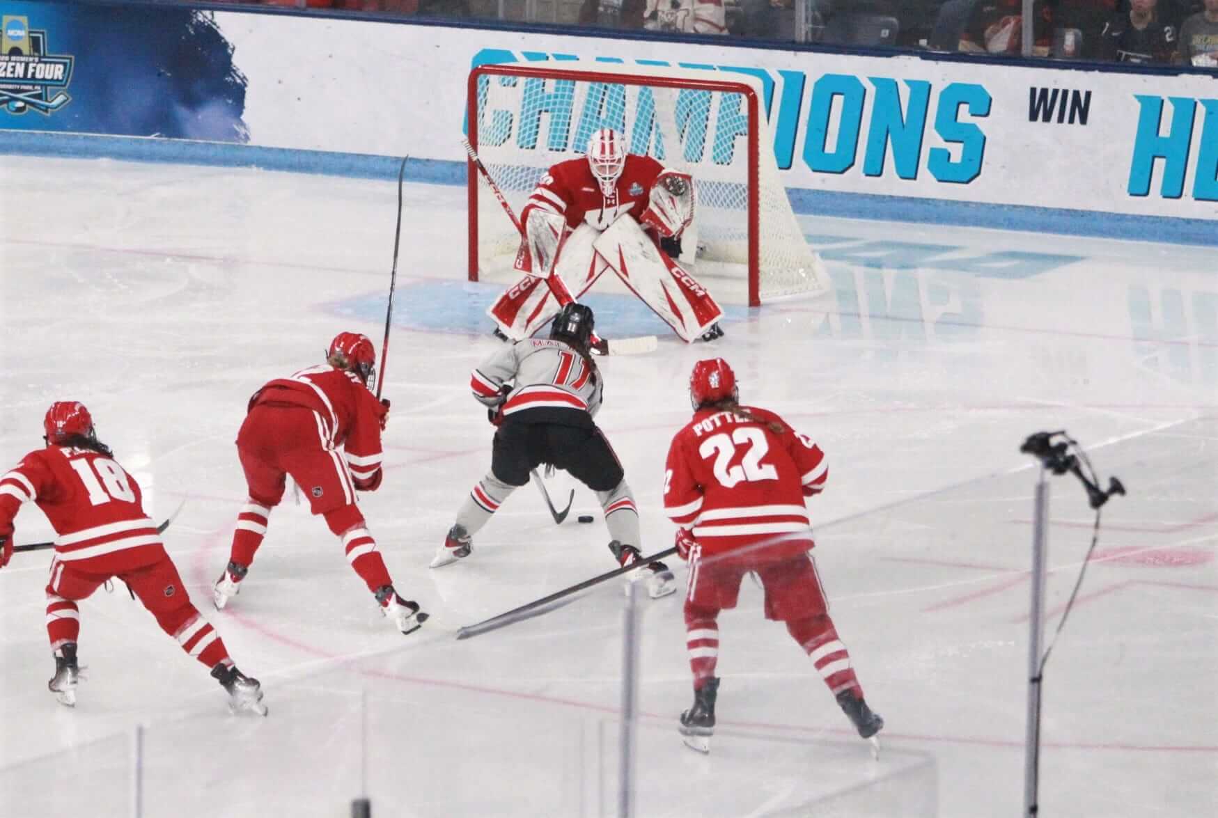 Wisconsin goaltender Ava McNaughton stares down a shot by Ohio State's Kaia Malachino during the second period of the national championship game at Pegula Ice Arena in University Park, Pa. on Sunday March 22, 2026.