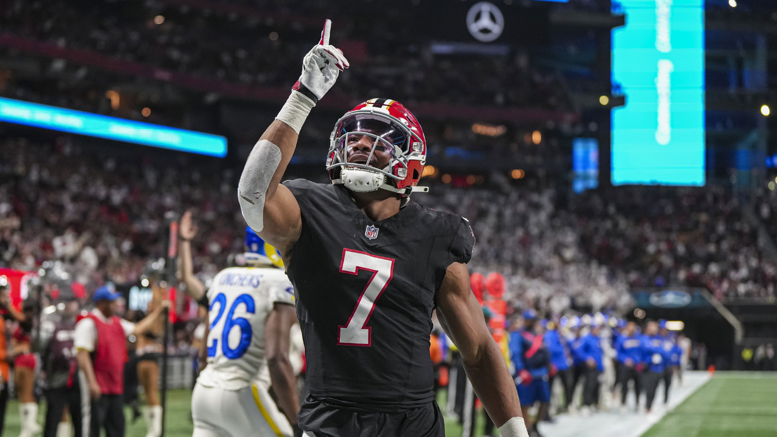 Atlanta Falcons running back Bijan Robinson (7) reacts after catching a touchdown pass against the Los Angeles Rams during the first quarter at Mercedes-Benz Stadium.