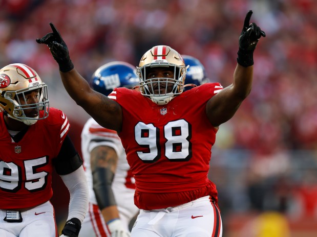 San Francisco 49ers' Javon Hargrave (98) celebrates his sack against the New York Giants in the second quarter at Levi's Stadium in Santa Clara, Calif., on Thursday, Sept. 21, 2023. (Nhat V. Meyer/Bay Area News Group)
