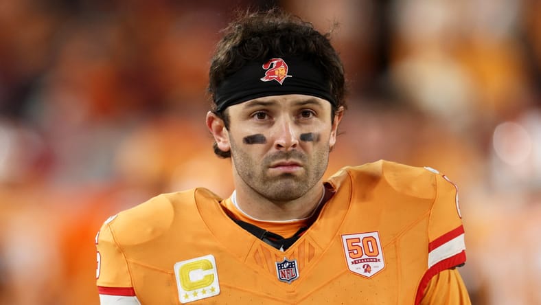 Baker Mayfield watches from the sideline during fourth quarter against the Falcons. Vikings rumor buzz