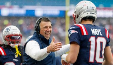 New England Patriots head coach Mike Vrabel celebrates with quarterback Drake Maye (10) after a touchdown during the first half of an NFL football game against the Buffalo Bills, Sunday, Dec. 14, 2025, in Foxborough, Mass.