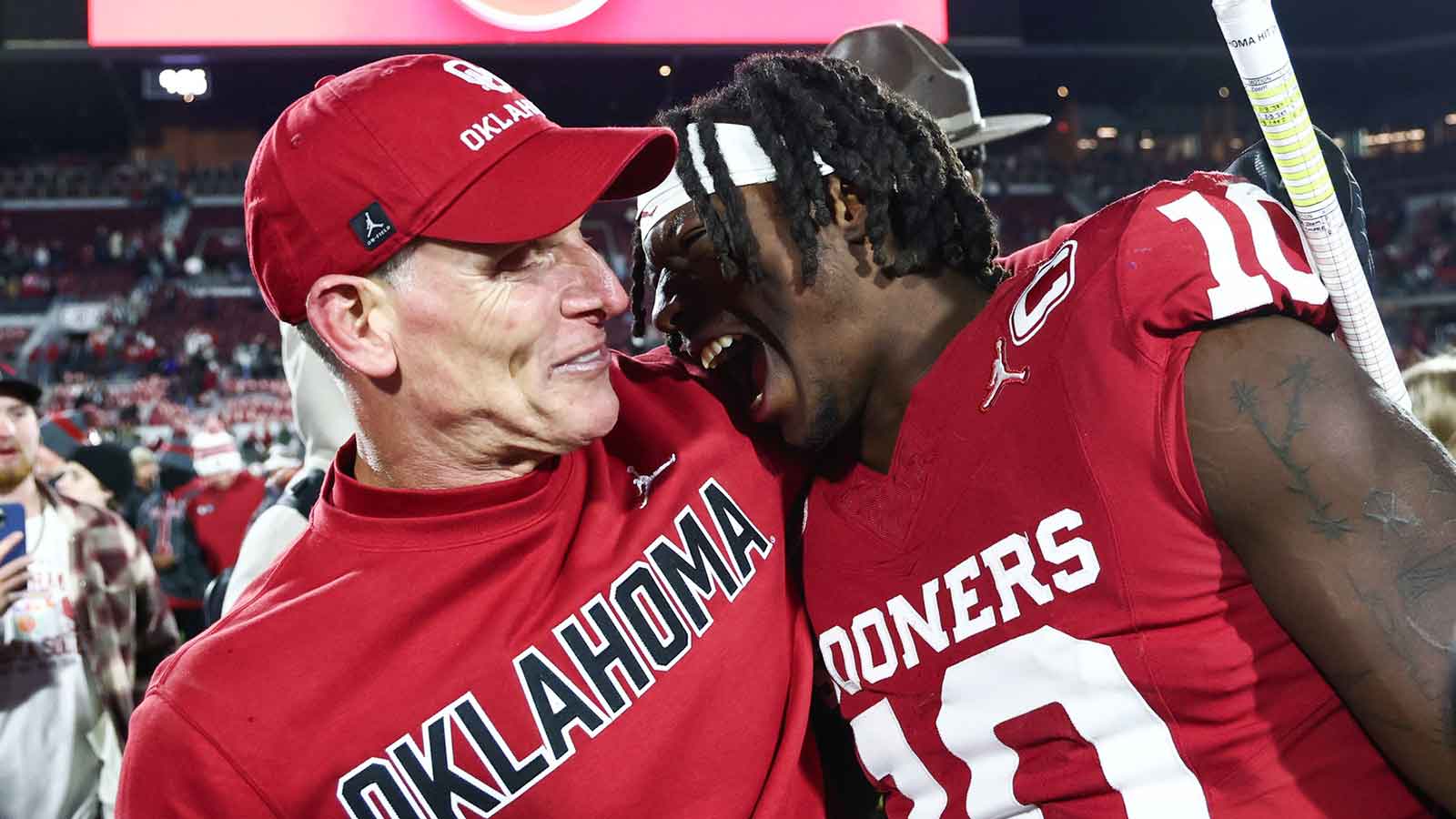 Oklahoma Sooners head coach Brent Venables hugs Oklahoma Sooners linebacker Kip Lewis (10) after the game at against the Louisiana State Tigers Gaylord Family-Oklahoma Memorial Stadium.
