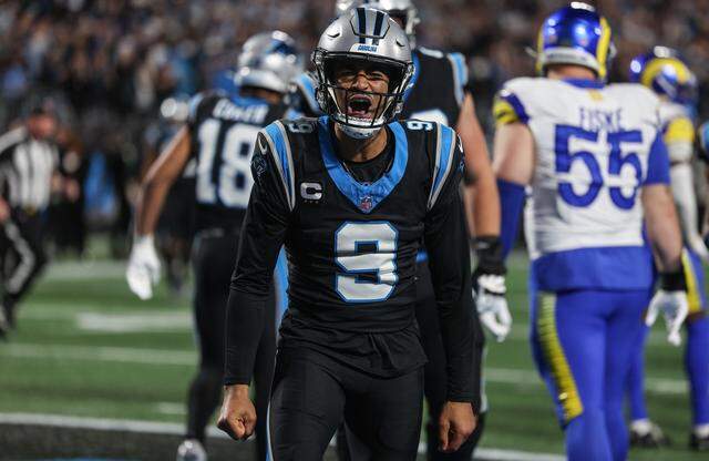 Panthers quarterback Bryce Young celebrates scoring a rushing touchdown during the the Wild Card playoff game against the Rams at Bank of America Stadium in Charlotte on Saturday, January 10, 2026.