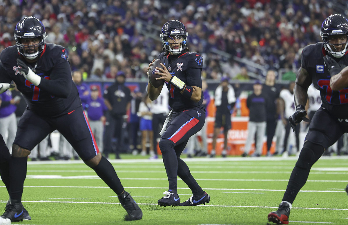 Houston Texans quarterback C.J. Stroud (7) looks for an open receiver during the game against the Baltimore Ravens at NRG Stadium.