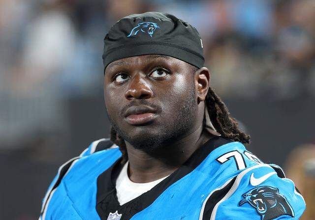 Carolina Panthers tackle Ikem Ekwonu sits on the team bench during action against the Cleveland Browns on Friday, August 8, 2025 at Bank of America Stadium in Charlotte, NC. 