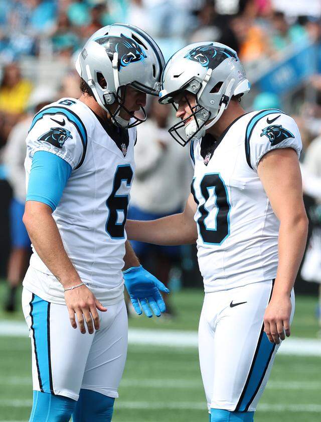 Carolina Panthers punter Sam Martin, left and kicker Ryan Fitzgerald, right, bumps helmets following Fitzgerald's extra point kick against the Miami Dolphins on Sunday, October 5, 2025 at Bank of America Stadium in Charlotte, NC. The Panthers defeated the Dolphins 27-24.
