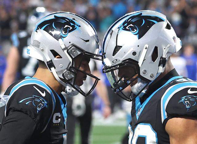 Carolina Panthers quarterback Bryce Young and running back Chuba Hubbard, right, celebrate Hubbard’s touchdown run against the Los Angeles Rams at Bank of America Stadium on Saturday, Jan. 10, 2026. The Rams defeated the Panthers 34-31.