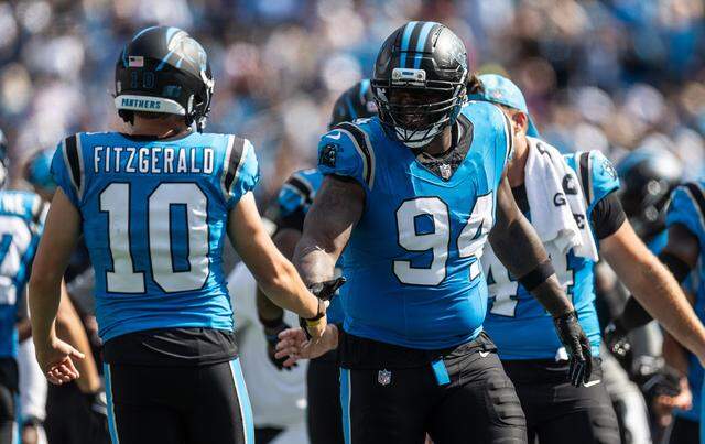 Carolina Panthers defensive end A'Shawn Robinson, right, celebrates with Carolina Panthers kicker Ryan Fitzgerald at the Bank of America Stadium in Charlotte, N.C., on Sunday, September 21, 2025.