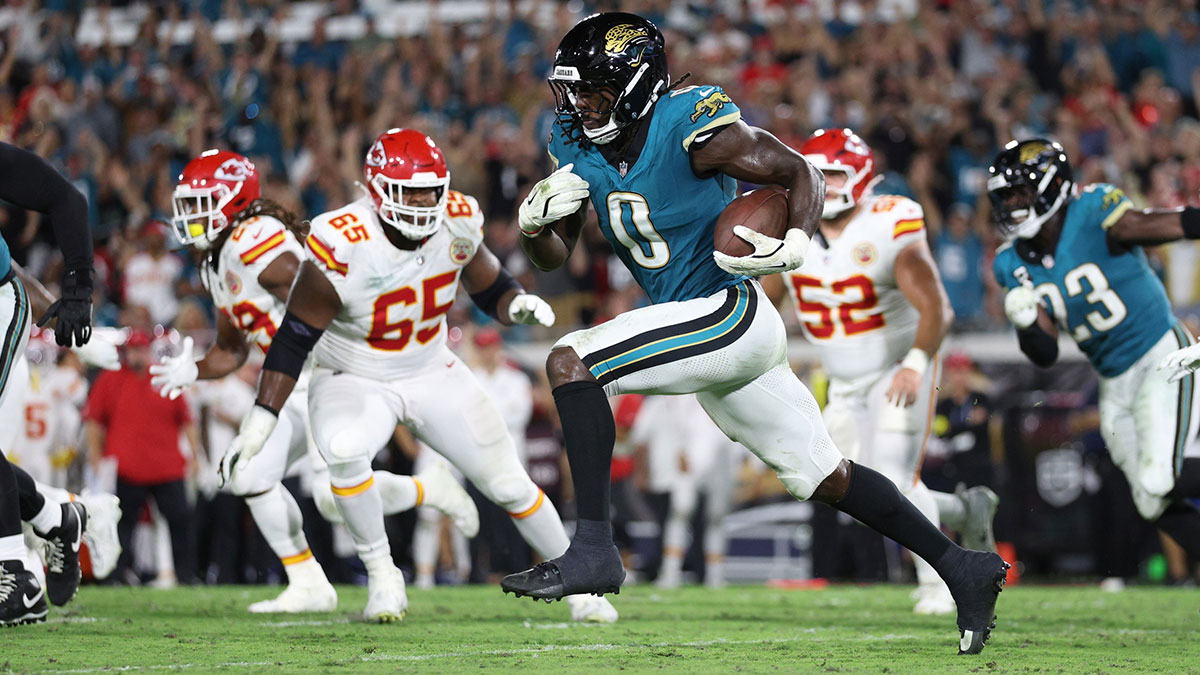 Jacksonville Jaguars linebacker Devin Lloyd intercepts a pass and returns it for a touchdown during the second half against the Kansas City Chiefs at EverBank Stadium.