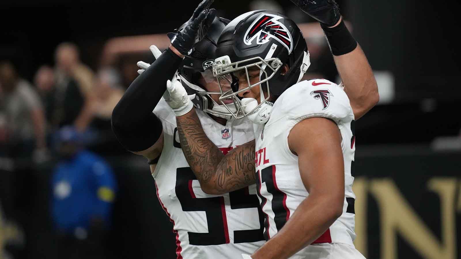 Atlanta Falcons safety Xavier Watts (31) reacts with linebacker Kaden Elliss (55) after making an interception against the New Orleans Saints during the second half at Caesars Superdome.