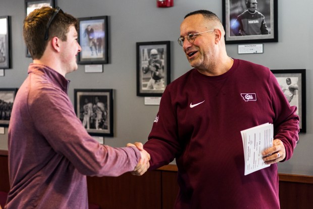 New University of Montana football coach Bobby Kennedy, right, shakes hands with Grizzlies quarterback Gage Sliter on Kennedy's first day on the job in early February. Kennedy, 59, was named Grizzlies head coach to replace Bobby Hauck, who retired after 15 seasons. Kennedy is from Boulder and he played football at Boulder High School and at the University of Northern Colorado in Greeley. The job is Kennedy's first as a head coach in a 35-year career as a college coach. (Courtesy/University of Montana, Marley Barboeisel).