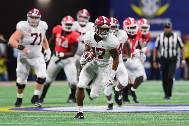 Jaylen Waddle of the Alabama Crimson Tide runs on his way to scoring a 51-yard touchdown in the third quarter against the Georgia Bulldogs during the 2018 SEC Championship Game at Mercedes-Benz Stadium on Dec. 1, 2018 in Atlanta, Georgia. (Photo by Scott Cunningham/Getty Images)