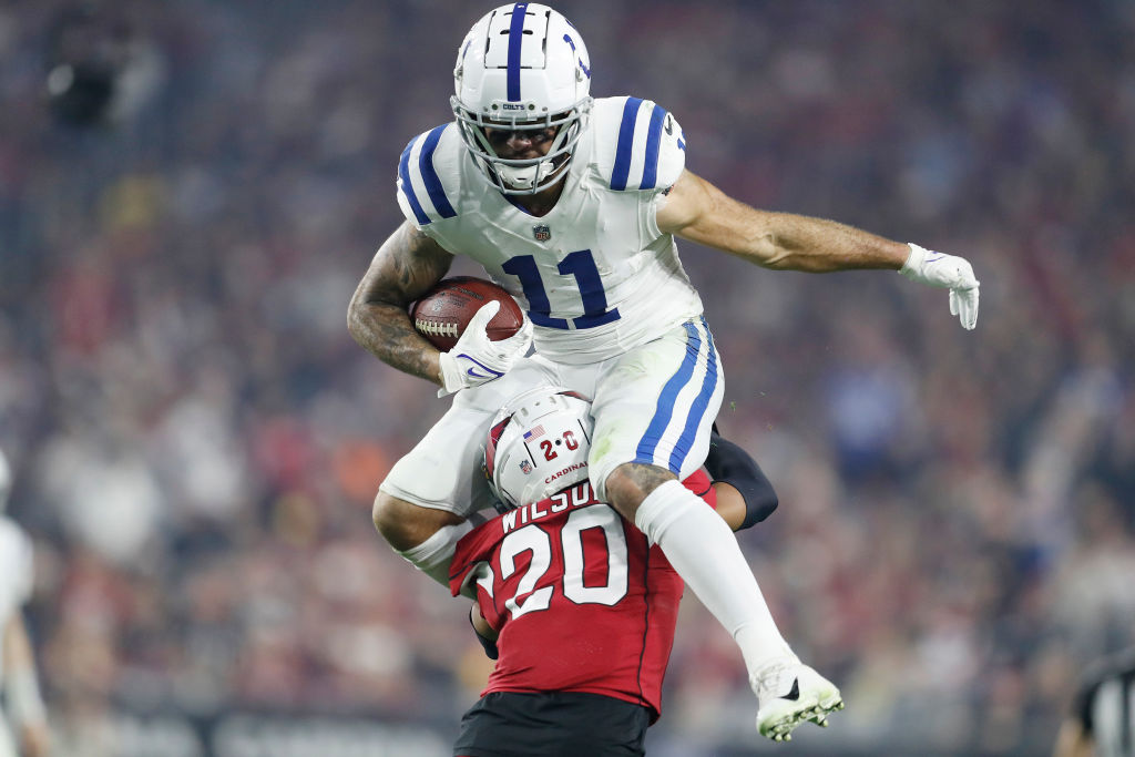 Michael Pittman jumps over an Arizona player.
