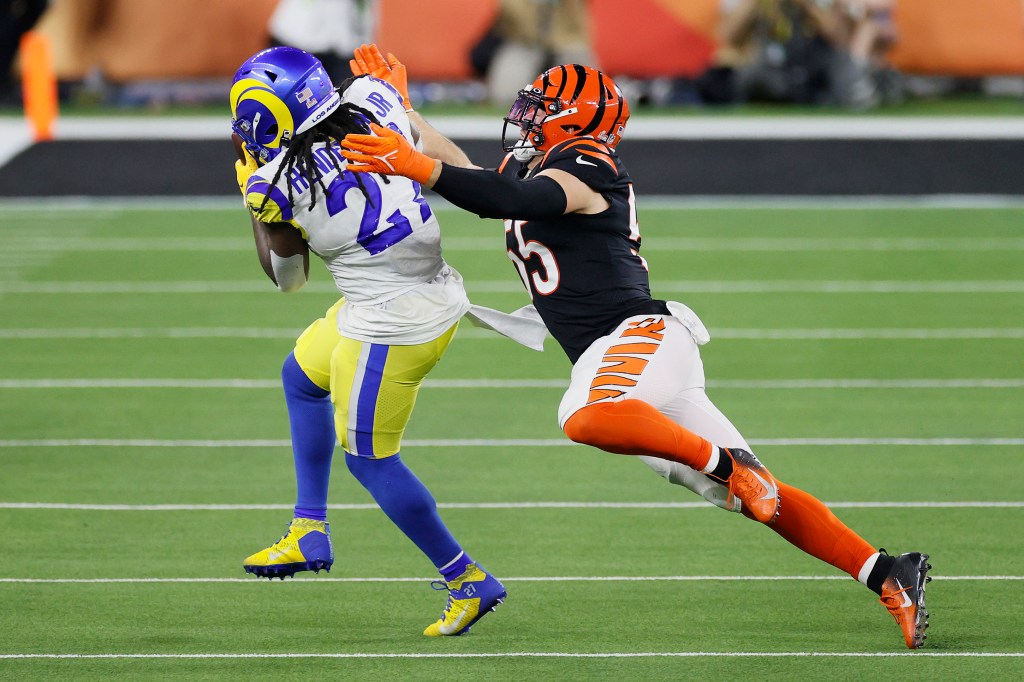Darrell Henderson #27 of the Los Angeles Rams catches the ball as Logan Wilson #55 of the Cincinnati Bengals defends during Super Bowl LVI at SoFi Stadium on February 13, 2022 in Inglewood, California. The Los Angeles Rams defeated the Cincinnati Bengals