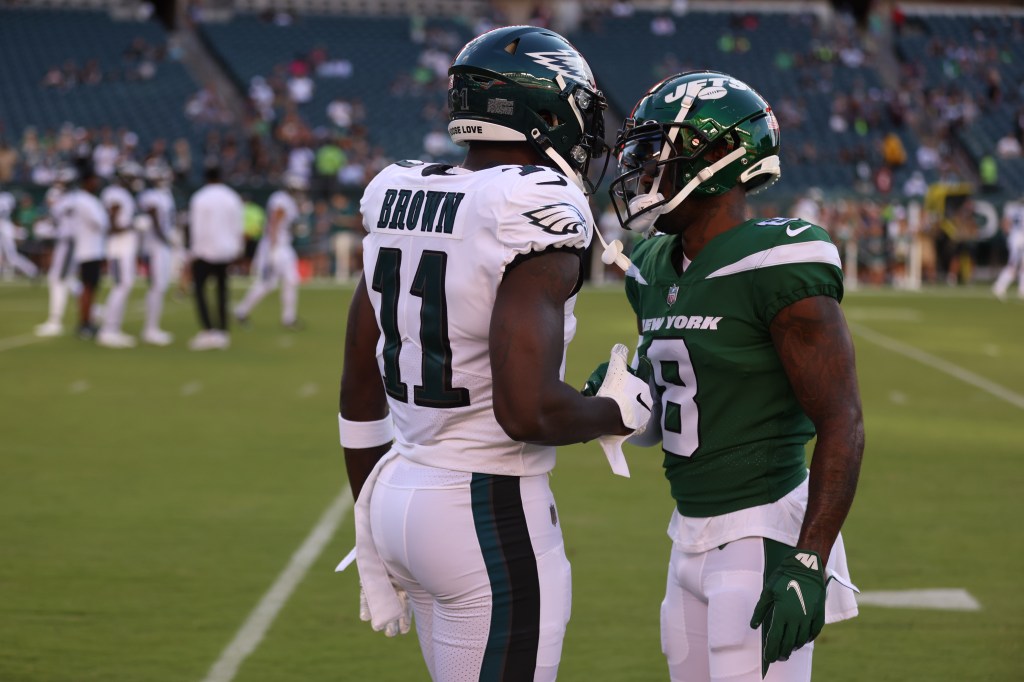 Elijah Moore of the New York Jets and A.J. Brown of the Philadelphia Eagles shake hands prior to NFL football game at Lincoln Financial Field on August 12, 2022 in Philadelphia, Pennsylvania.