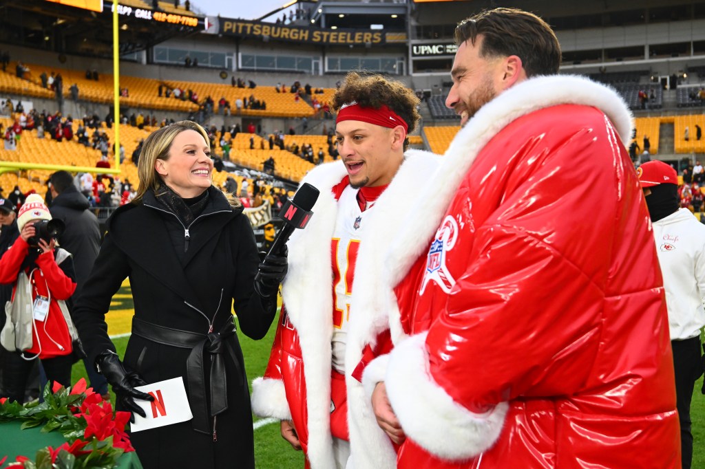 Patrick Mahomes #15 and Travis Kelce #87 of the Kansas City Chiefs speaks with a NETFLIX reporter after the game against the Pittsburgh Steelers at Acrisure Stadium on December 25, 2024 in Pittsburgh, Pennsylvania. 