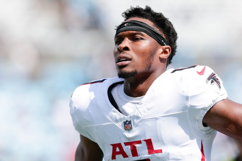 Darnell Mooney #1 of the Atlanta Falcons heads to the locker room for halftime during an NFL 2025 game against the Carolina Panthers at Bank of America Stadium on September 21, 2025 in Charlotte, North Carolina.