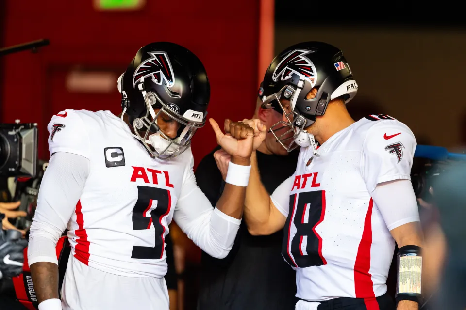 Michael Penix Jr. #9 of the Atlanta Falcons interacts iwth Kirk Cousins #18 of the Atlanta Falcons before a NFL game between the Atlanta Falcons and the San Francisco 49ers