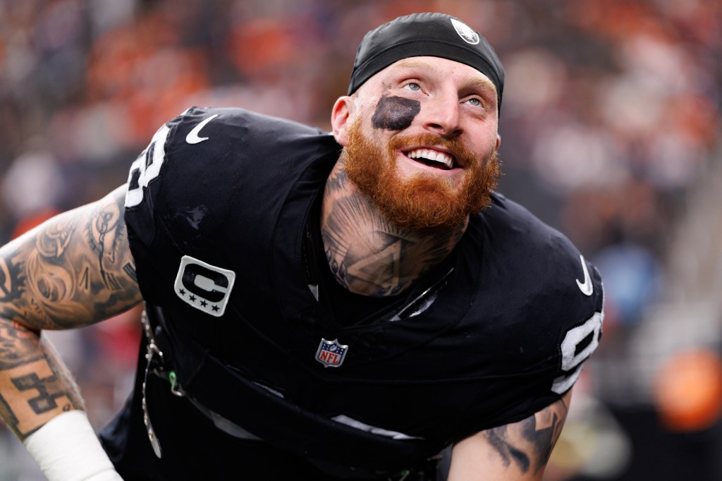 Maxx Crosby #98 of the Las Vegas Raiders stretches on the field prior to an NFL football game against the Denver Broncos at Allegiant Stadium on December 07, 2025 in Las Vegas, Nevada.